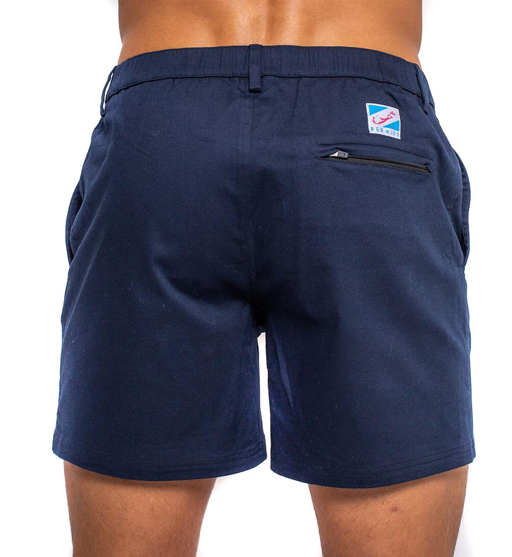 Ruby Tartarus navy cotton swim shorts laid flat, showing the waistband and relaxed fit, perfect for summer beachwear.