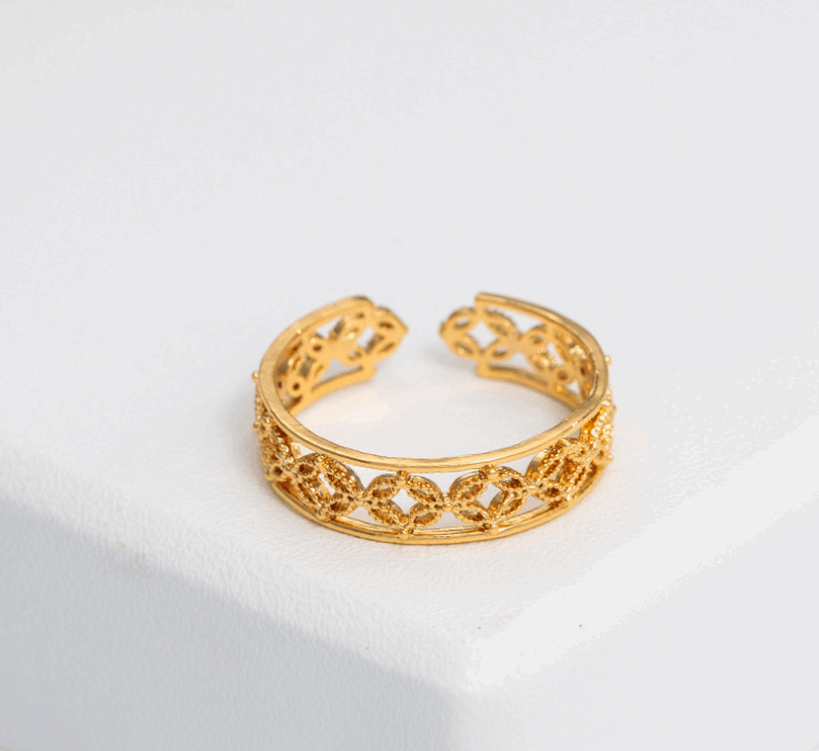 Lime Cress Hélodie Ring in gold-tone jewelry with intricate design, showcasing elegant craftsmanship and stylish detail.