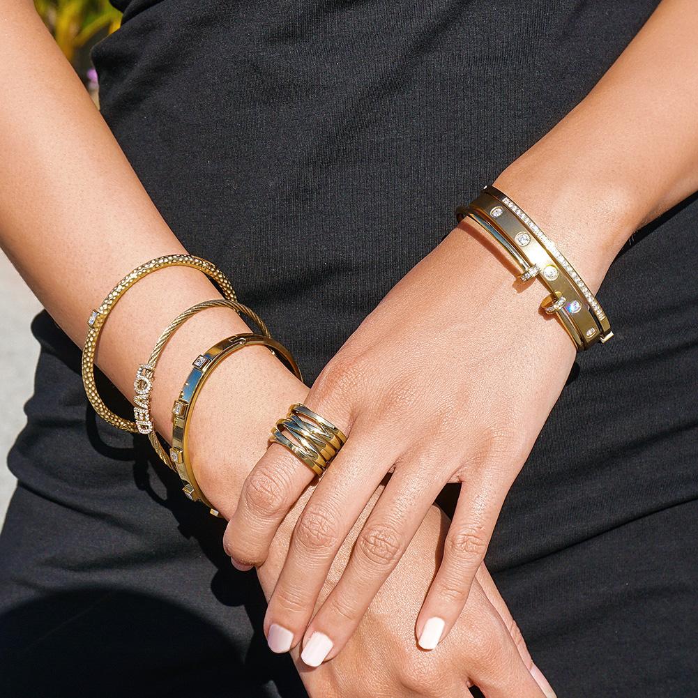 Set of layered bangle rings by Lavender Phoebe featuring mixed metal designs and intricate details in a jewelry and watches collection.