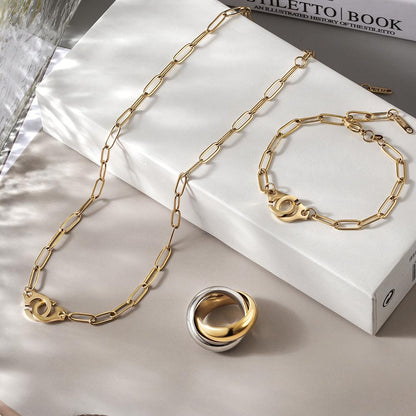 Lavender Phoebe Paperclip Link Jewelry Set featuring gold-tone paperclip chain necklaces and matching earrings.