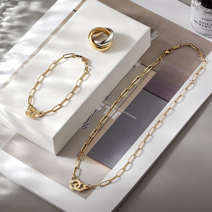Lavender Phoebe Paperclip Link Jewelry Set featuring layered chain necklaces and matching earrings with gold-tone finish.