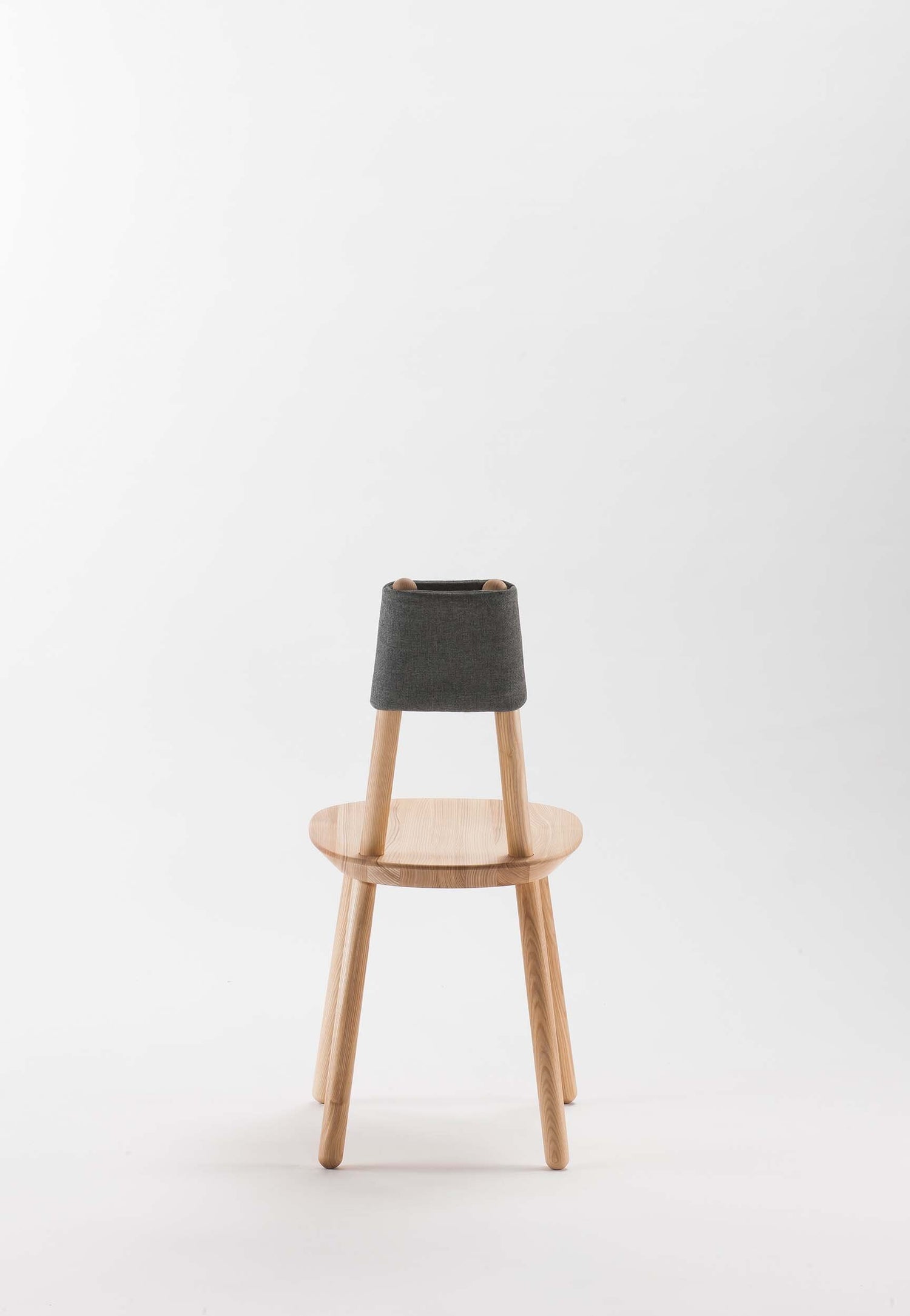 Aquamarine Poppy Naïve Dining Chair with wooden legs and upholstered seat, modern furniture with a clean, minimalist design.
