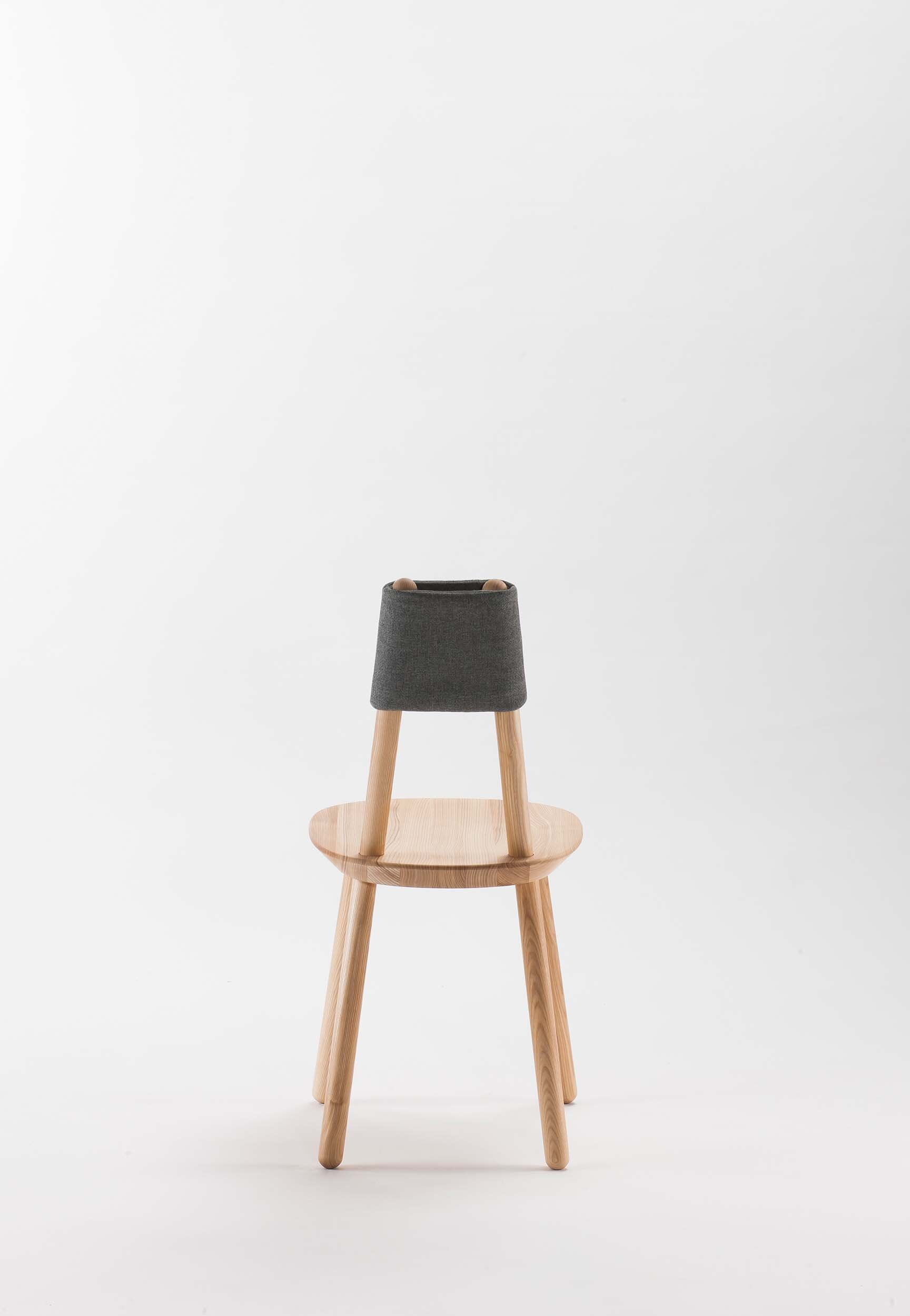Aquamarine Poppy Naïve Dining Chair with wooden legs and upholstered seat, modern furniture with a clean, minimalist design.