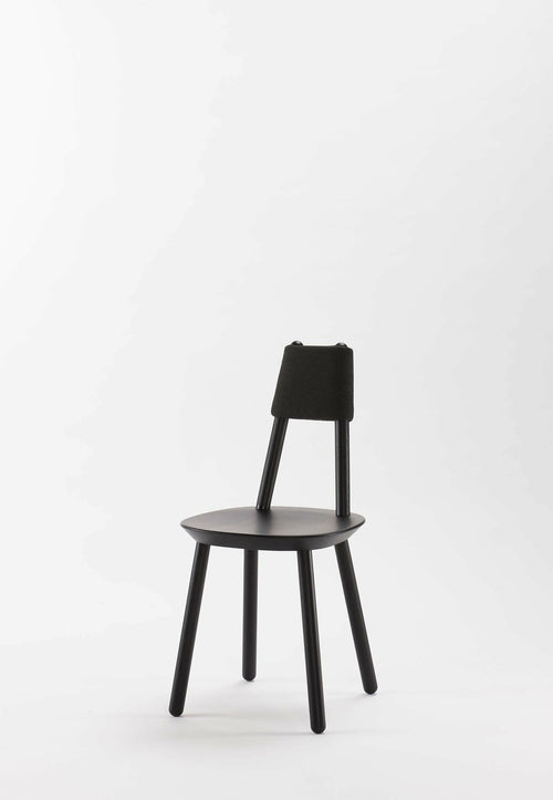 Black Naïve Dining Chair by Aquamarine Poppy featuring a sleek modern design and comfortable upholstered seat.