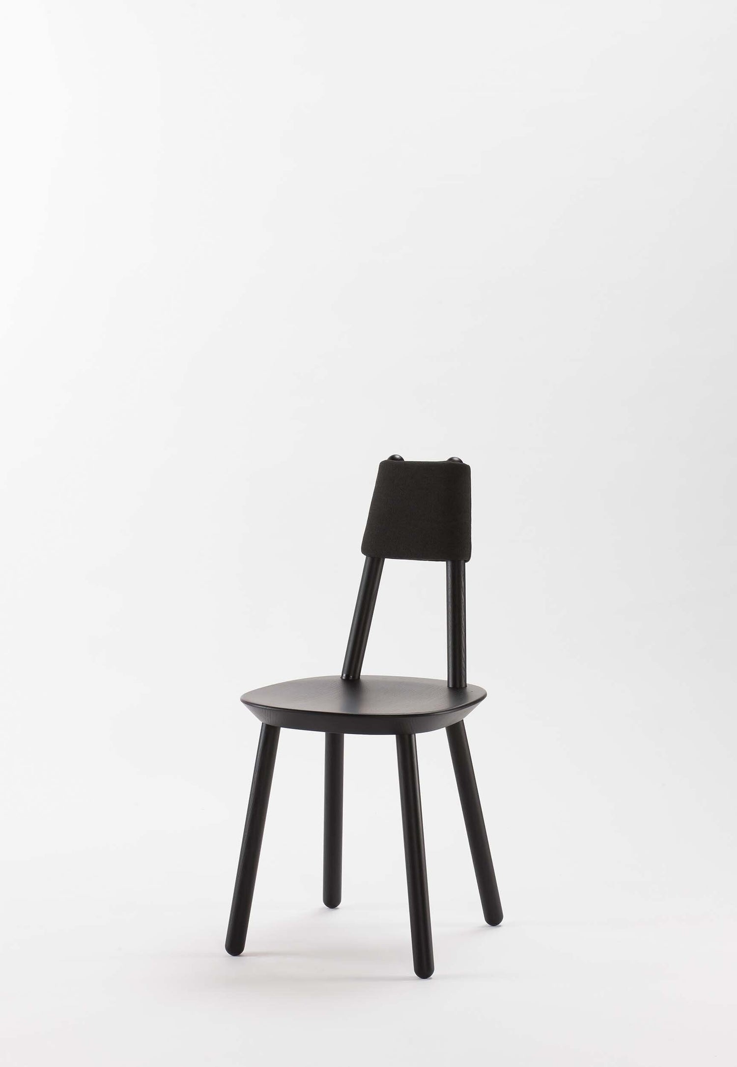 Naïve black dining chair from Aquamarine Poppy with a modern, sleek design and upholstered seat, ideal for contemporary dining rooms.