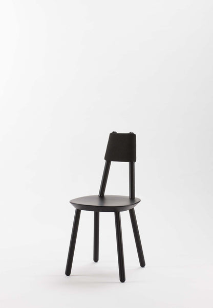 Naïve black dining chair from Aquamarine Poppy with a modern, sleek design and upholstered seat, ideal for contemporary dining rooms.