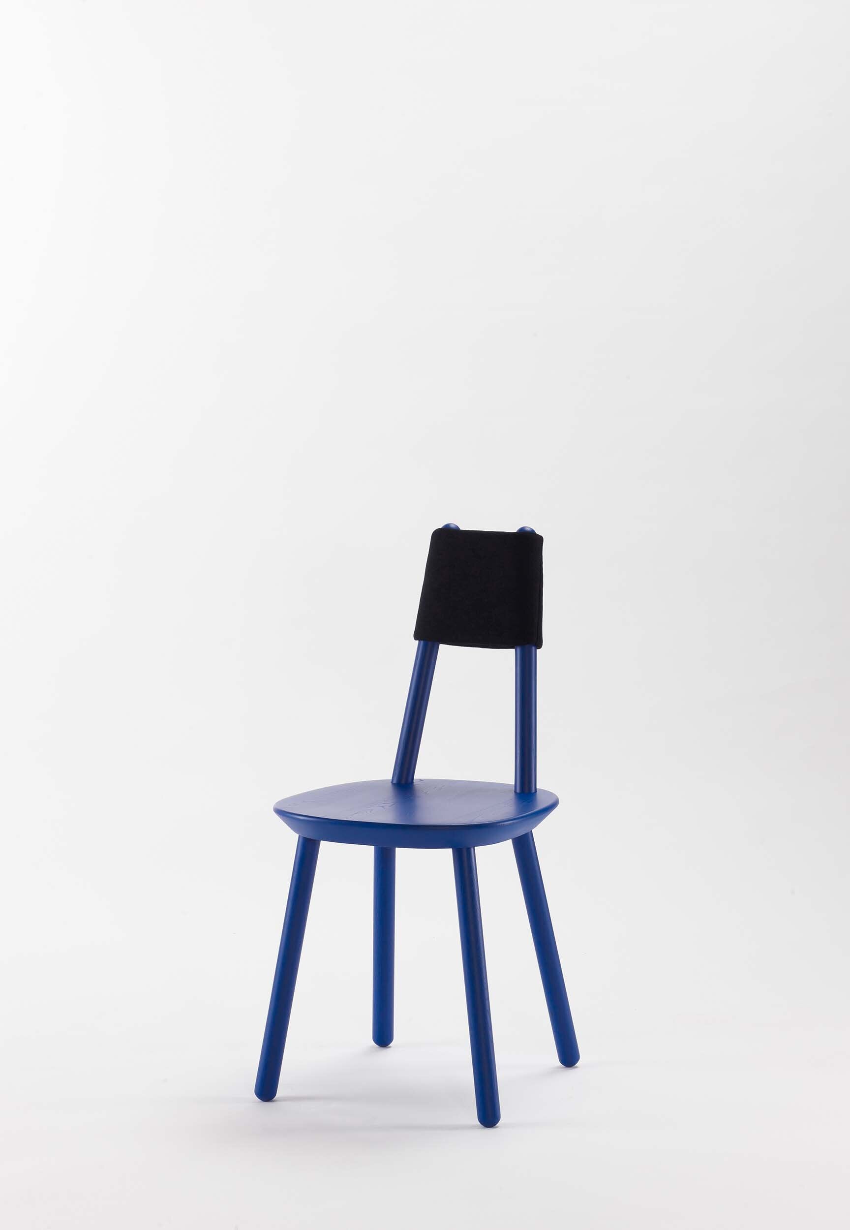 Blue Naïve Dining Chair by Aquamarine Poppy, showcasing smooth wooden legs and a sleek, modern seat design in a contemporary furniture style.