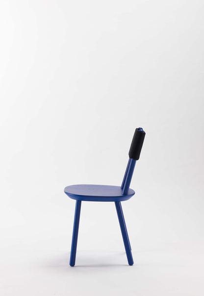 Aquamarine Poppy Naïve Dining Chair with blue upholstered seat and wooden legs, modern furniture design.