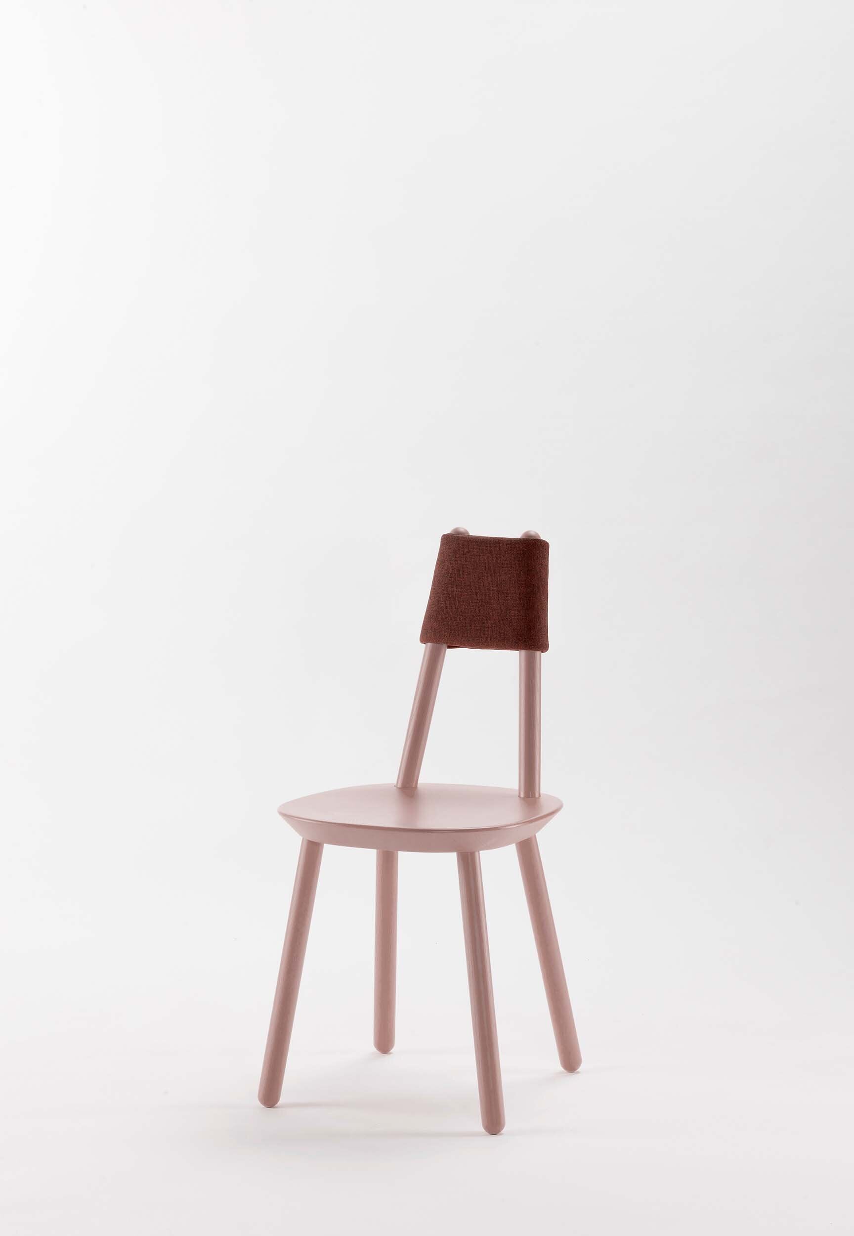 Naïve pink dining chair by Aquamarine Poppy featuring a soft fabric cushion and modern wooden frame.