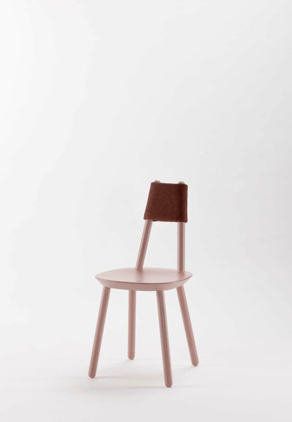 Naïve dining chair by Aquamarine Poppy in dusty pink fabric with wooden legs, modern furniture design for dining room decor.