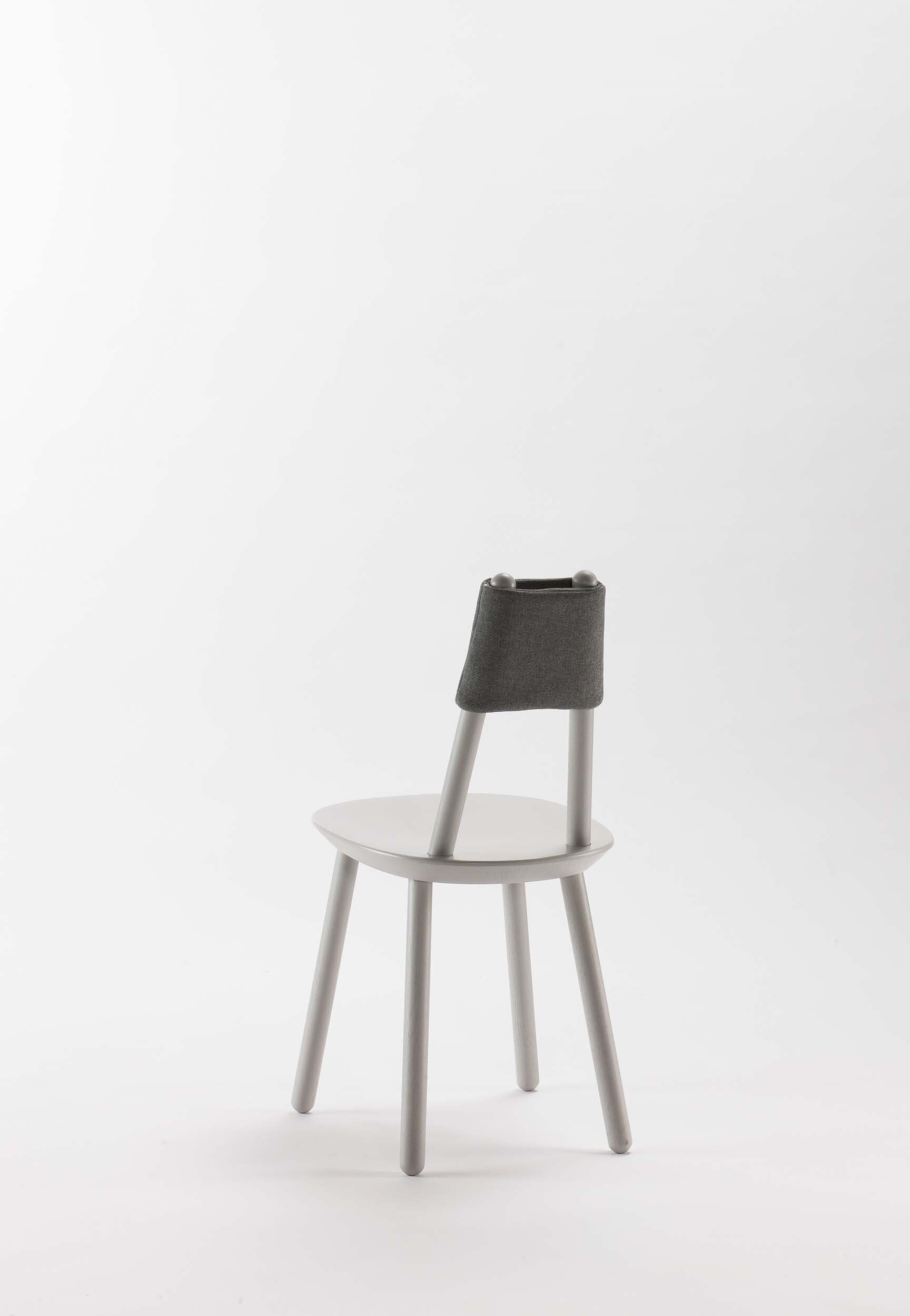 Aquamarine Poppy Naïve Dining Chair with grey upholstered seat and wooden legs, modern furniture design.
