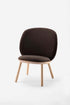 Naïve Low Chair by Aquamarine Poppy, brown wooden furniture piece with a sleek, minimalist design and curved backrest.