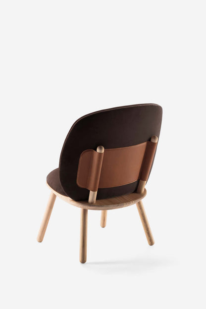 Aquamarine Poppy Naïve Low Chair in brown with a modern, minimalist design, showcasing smooth wooden legs and a curved seat.