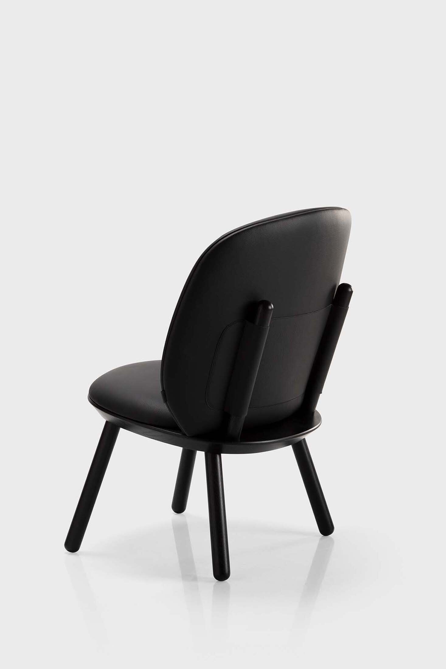 Aquamarine Poppy Naïve Low Chair in black, showcasing its modern, minimalistic furniture design and sleek seating surface.