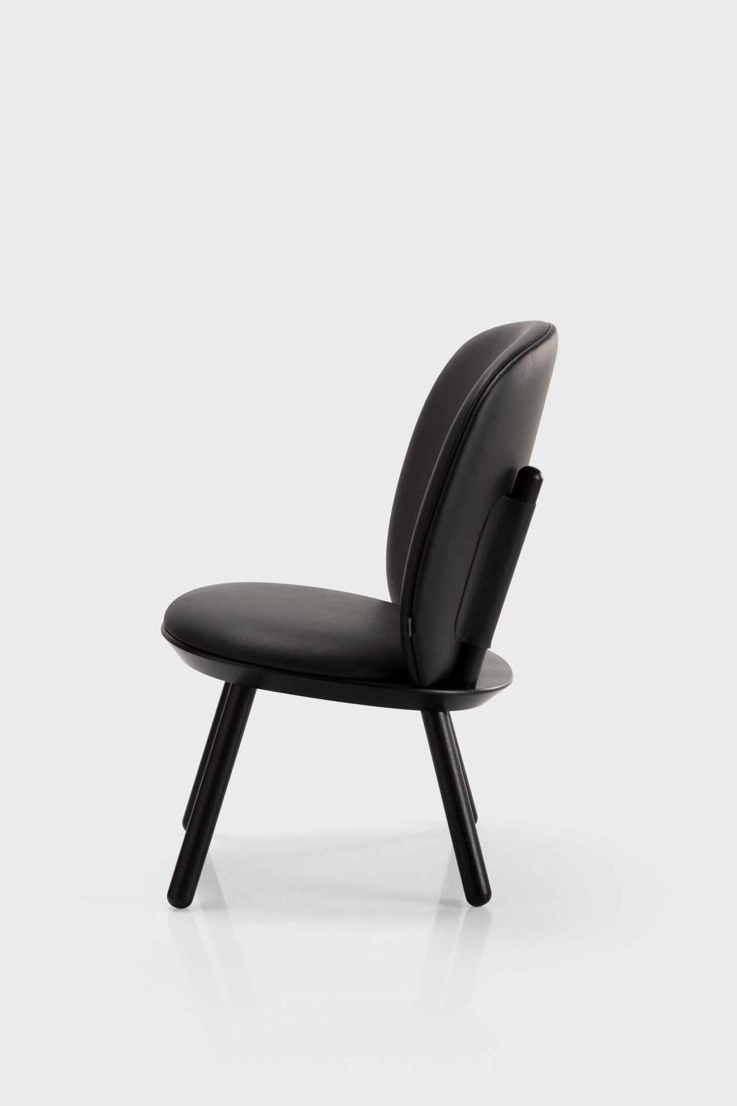 Black Naïve Low Chair by Aquamarine Poppy, modern furniture with a sleek design and curved wooden legs.