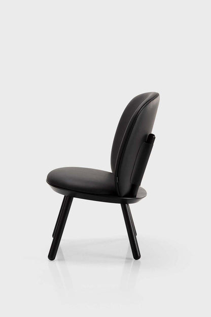 Black Naïve Low Chair by Aquamarine Poppy, modern furniture with a sleek design and curved wooden legs.