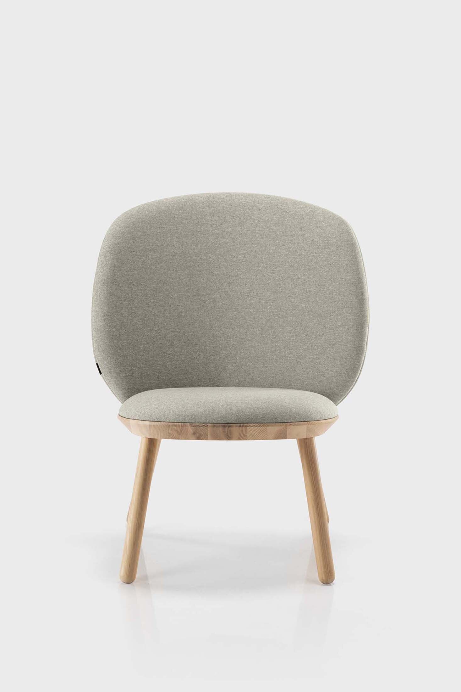 Beige Naïve Low Chair by Aquamarine Poppy featuring a modern, minimalist furniture design with a curved seat and wooden legs.
