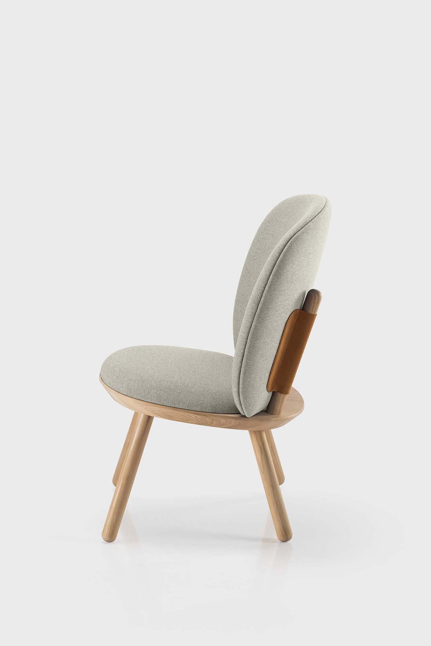Beige Naïve Low Chair by Aquamarine Poppy, showcasing its modern furniture design with smooth curves and comfortable seating.