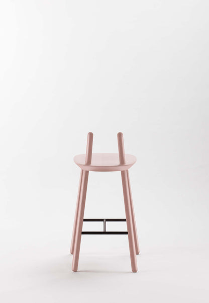 Dusty pink Naïve Semi Bar Stool by Aquamarine Poppy with a modern, curved design and wooden legs.