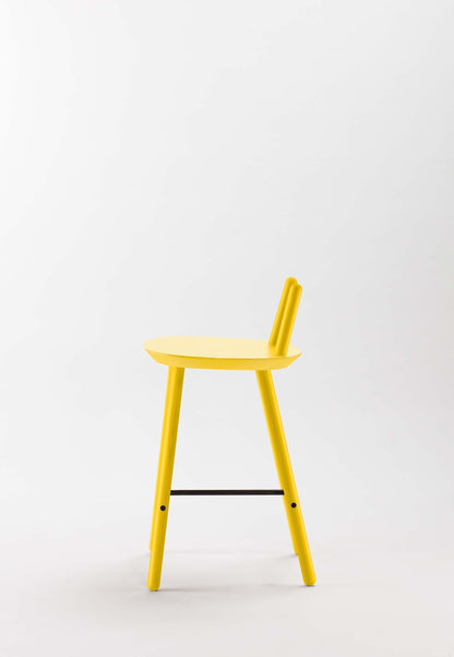 Yellow Naïve Semi Bar Stool by Aquamarine Poppy, showcasing its modern design and cushioned seat with wooden legs.