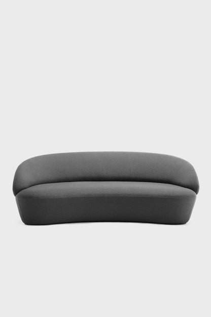 Aquamarine Poppy Naïve Sofa in grey fabric with plush cushions and modern design, shown from a side angle.