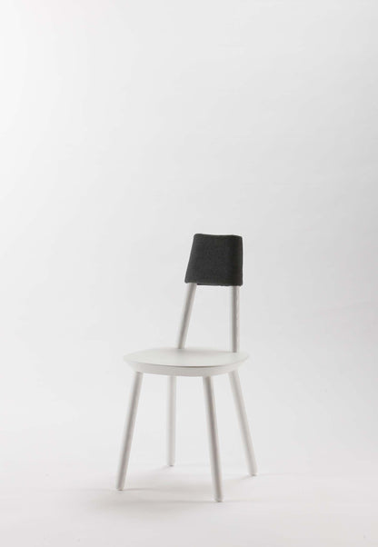 Naïve Dining Chair by Aquamarine Poppy, white upholstered furniture with sleek modern design and wooden legs.