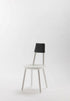 White Naïve Dining Chair by Aquamarine Poppy, showcasing sleek modern furniture with smooth curves and wooden legs.