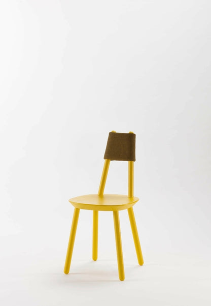 Naïve Dining Chair by Aquamarine Poppy with yellow upholstered seat and wooden legs, modern furniture design.