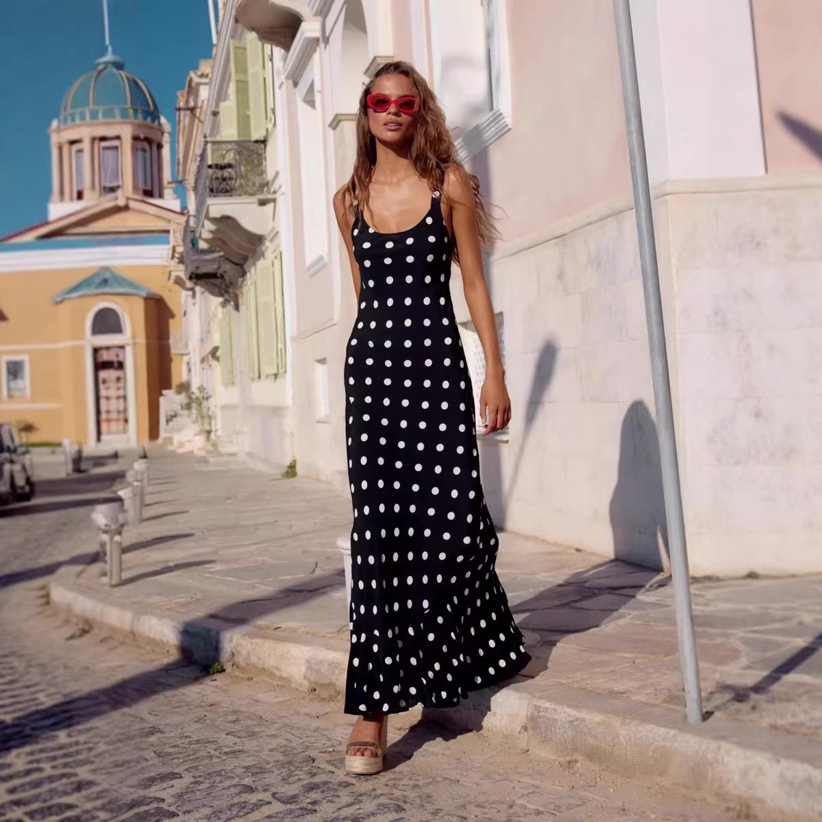 Polka dot printed summer dress by Pear Daisy featuring a fitted waist, ruffled details, and a sheath style for a stylish look.