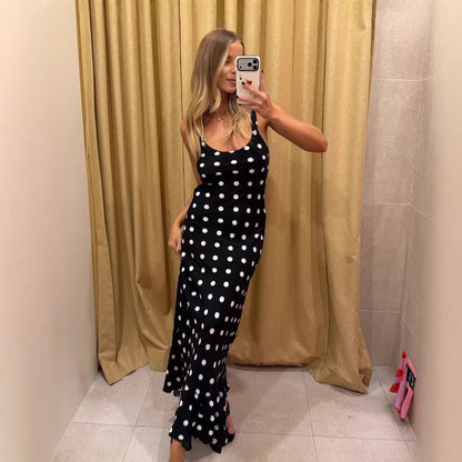 Polka dot summer dress by Pear Daisy featuring ruffled details, fitted waist, and sheath style for a stylish, summery look.