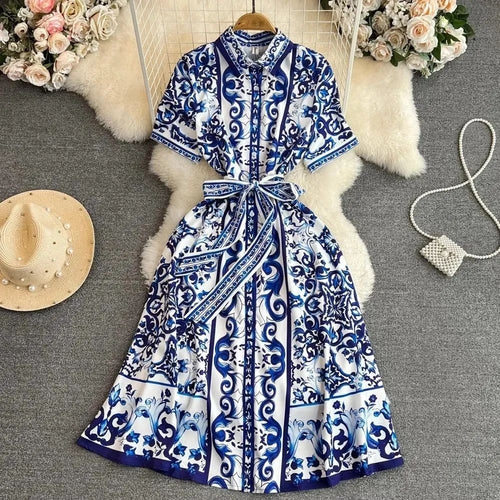 Women’s short sleeve printed beach holiday dress by Pear Daisy, lightweight summer dress with vibrant floral print.