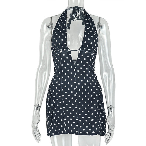 Polka dot slimming A-line dress by Pear Daisy featuring a deep V plunge neckline and printed design.