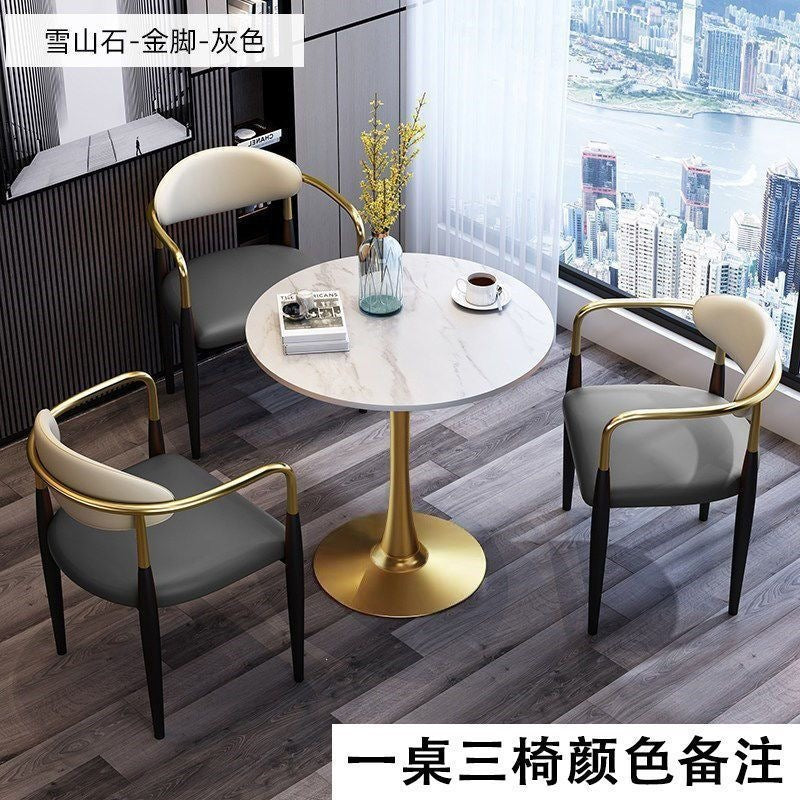 A light luxury sintered stone small round table for reception and negotiation tables and chairs, a trendy coffee table, balcony lounge table, and chair combination