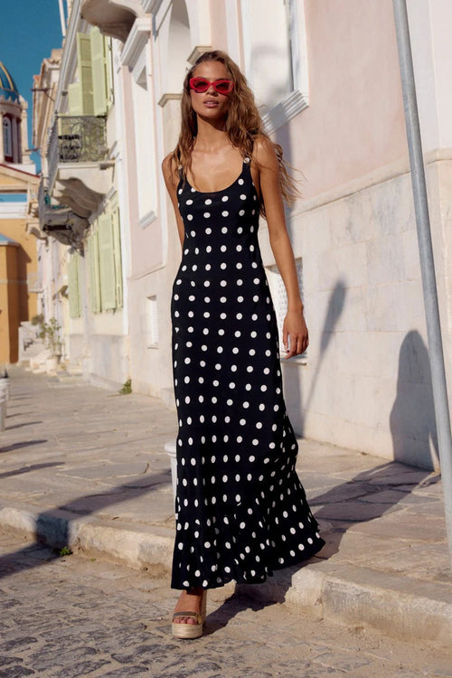 Polka dot printed summer dress by Pear Daisy featuring a waist-controlled sheath design with ruffled details for a stylish look.