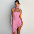 Carmine Juneberry slim fit halter off-shoulder dress with stringy details and selvedge fabric, displayed on a mannequin.