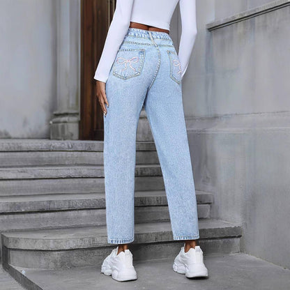 Carmine Juneberry DenimDare™ loose straight ripped denim jeans with distressed details and classic blue wash, styled for casual wear.