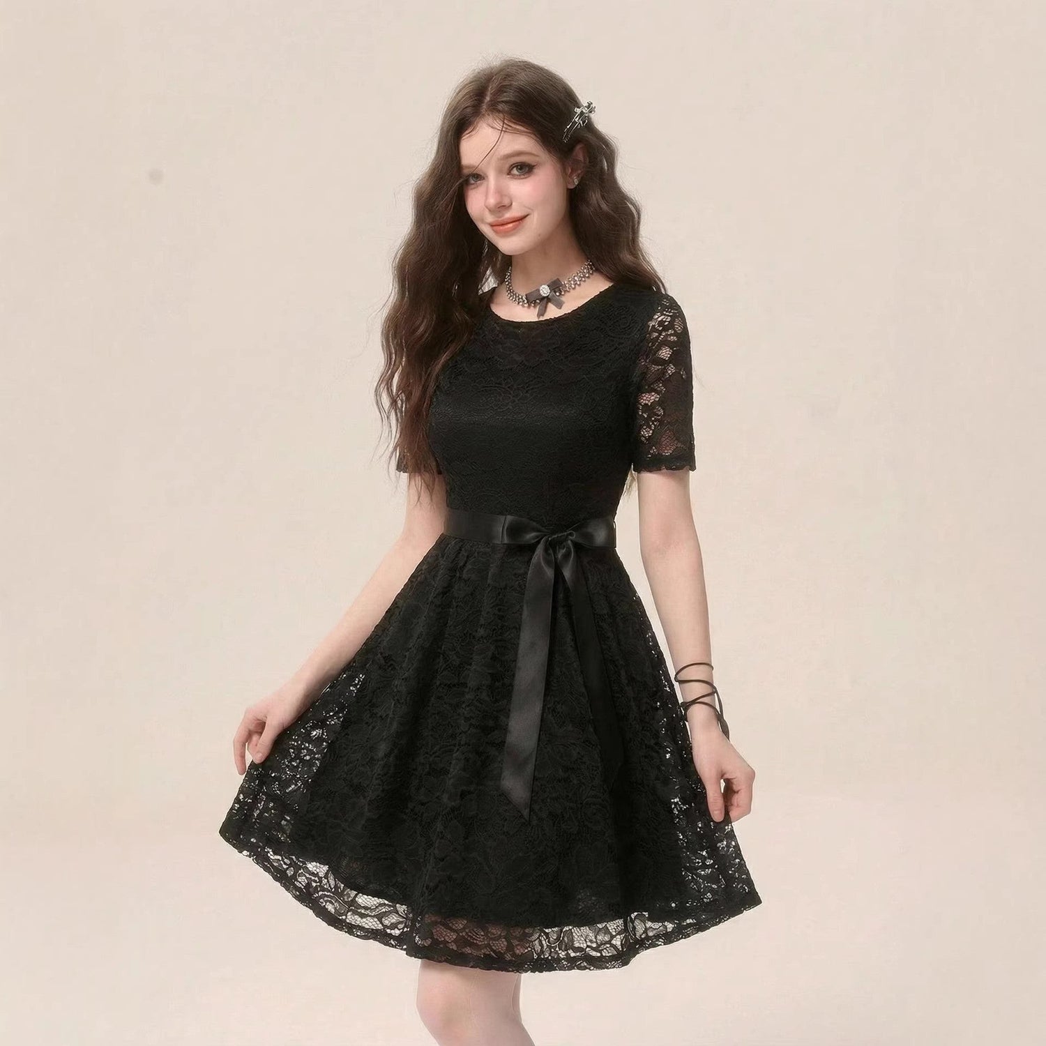Elegant black dress by Pear Daisy featuring artistic design, perfect for stylish home or social occasions.