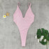 Pear Daisy backless one-piece swimsuit with T-shaped design and high slit, perfect for stylish beach or poolside wear.