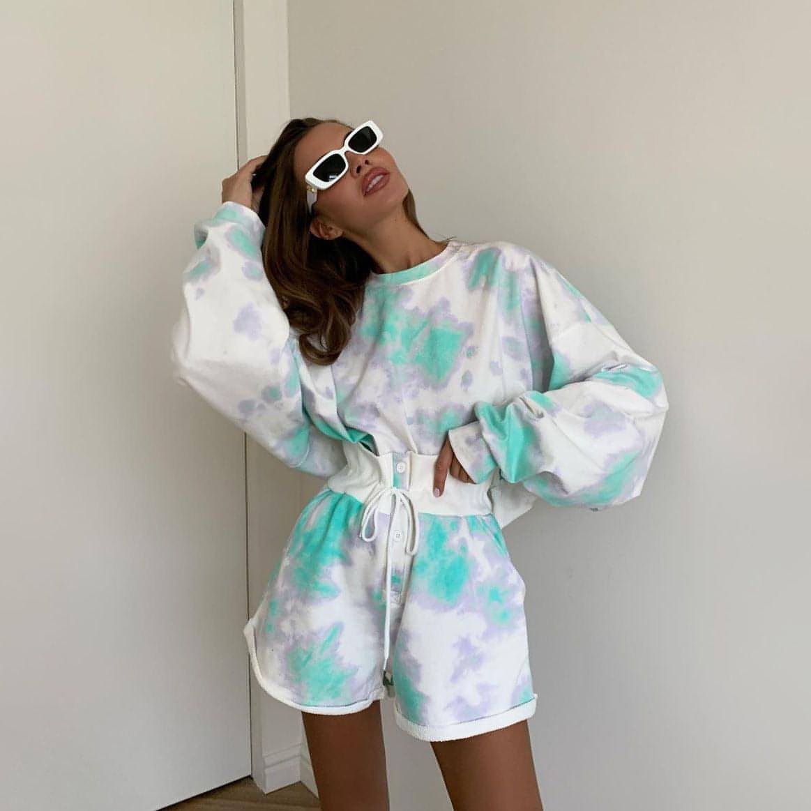 Tie-dye lace-up shorts and matching top set for women by Carmine Juneberry, casual two-piece outfit with colorful design.
