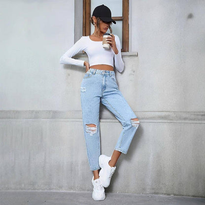 Carmine Juneberry DenimDare™ loose straight ripped denim jeans with distressed details, shown on a model in a casual setting.