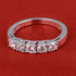 Sterling silver white moissanite 5-stone ring with elegant design, showcasing sparkling stones set in a polished band.