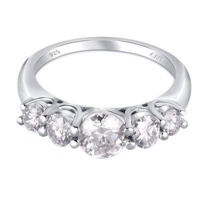 White moissanite 5-stone sterling silver ring featuring sparkling gemstones, elegant jewelry piece by Copper Juniper.