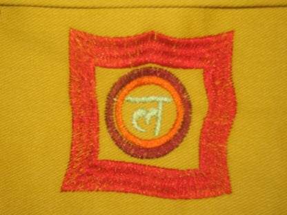Yellow OMSutra Chakra Yoga Kit Bag by Alabaster, designed for carrying yoga gear and accessories.