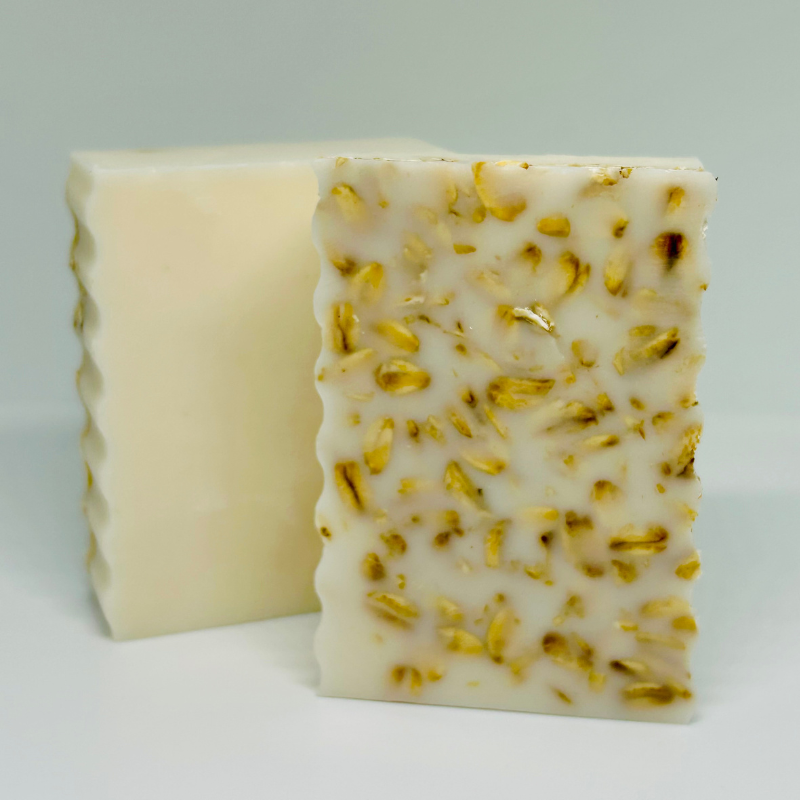 Bronze Alder oat, milk, and honey soap bar with creamy lather and natural ingredients, displayed on a neutral background.