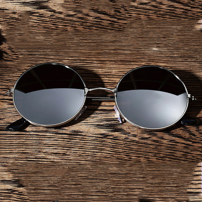 Vintage metal frame sunglasses by Teal Simba featuring classic design and dark tinted lenses.