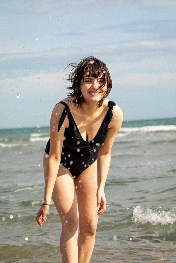 Black Egee one-piece lingerie by Silver Daedalus featuring elegant, eco-friendly design and smooth fabric.