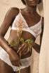 White lace Dawa lingerie bra by Silver Daedalus, featuring intricate lace details and a comfortable underwired design.