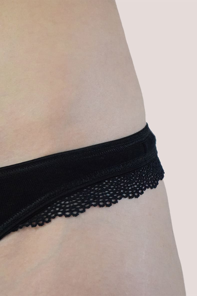Black String Elle lingerie by Silver Daedalus, featuring delicate lace and adjustable straps, shown on a mannequin.