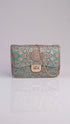 Handmade Oriental multicolor handbag by Chocolate Eros featuring beige and turquoise colors with intricate mandala patterns.