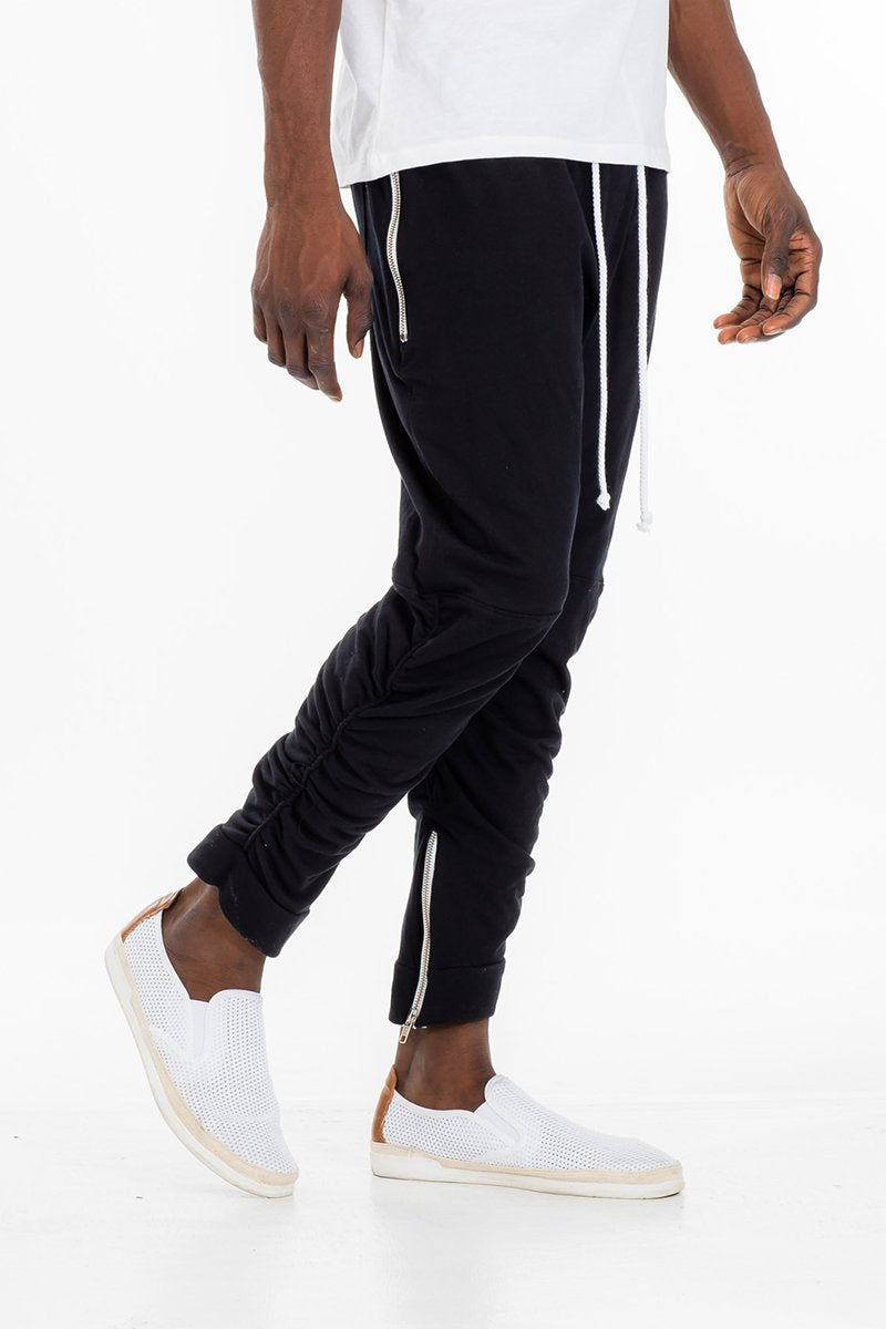 Black gathered bomber pants by Lime Milo, featuring a relaxed fit and elastic waistband, displayed on a neutral background.